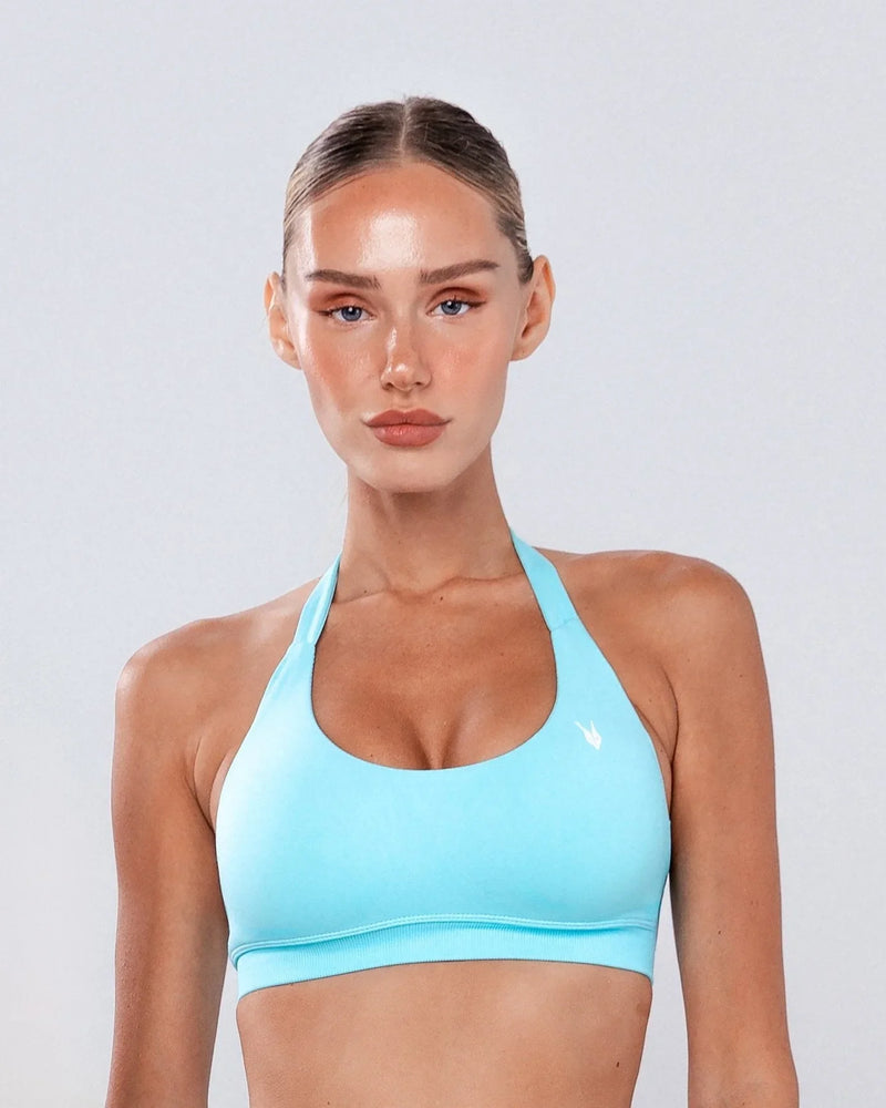טופ ספורט מחטב AURA SKY בצבע תכלת – גב מודגש, בד SEAMLESS, Inner Dragon