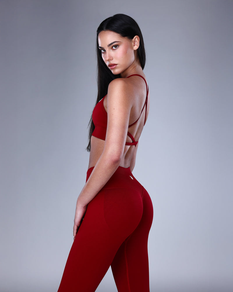 טופ ספורט מחטב NOVA WINE בגוון אדום יין – גזרת X-Back נשית, בד SEAMLESS, Inner Dragon